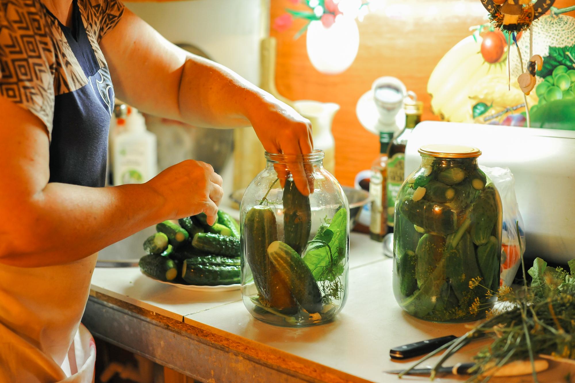 Small kitchen counter with local produce and utensils